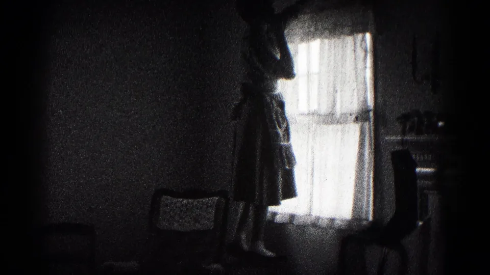 The woman remains silhouetted by the window in the Hagerstown interior, with period furniture partly visible.