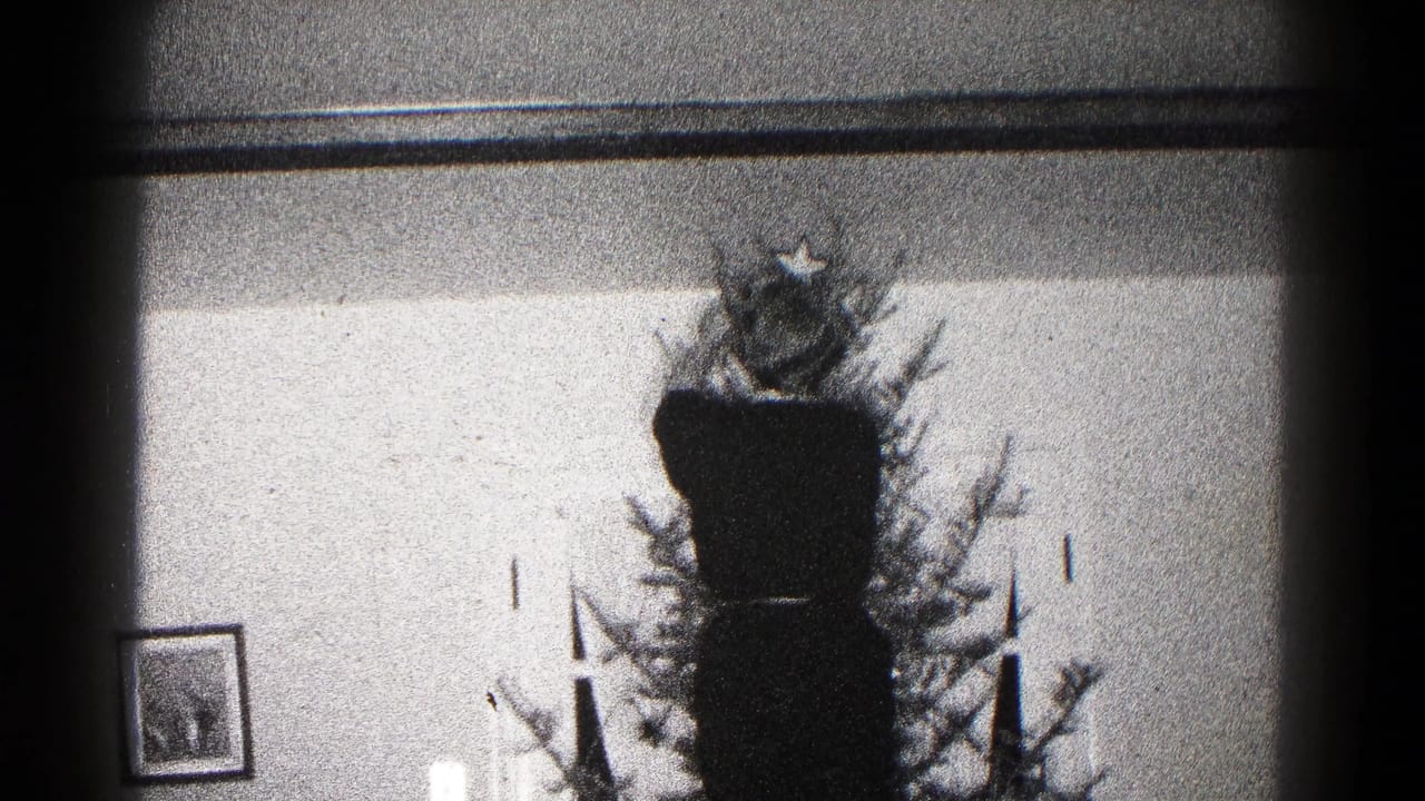A 1959 Hagerstown interior shows a Christmas tree with a star topper, framed picture, and candle-like decorations.
