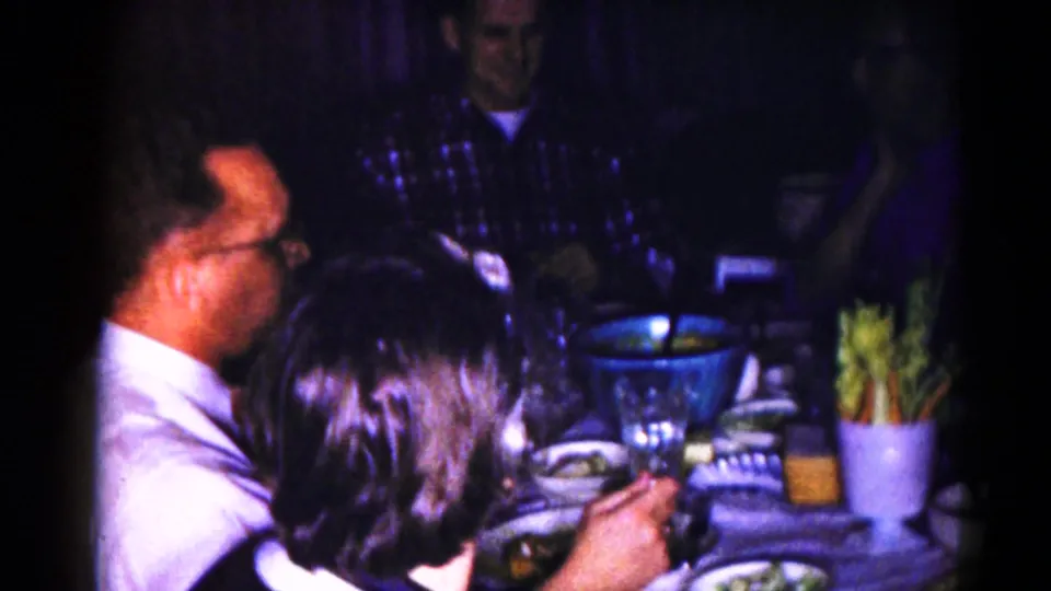 1959 Hagerstown frame with adults at a dinner table, a large blue bowl, glasses, and celery sticks visible.