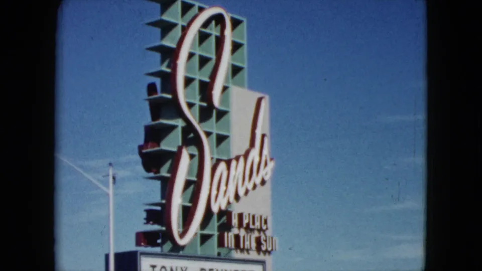 1959 Nevada frame focused on the Sands roadside sign and marquee with Tony Bennett and Joey Bishop listed.
