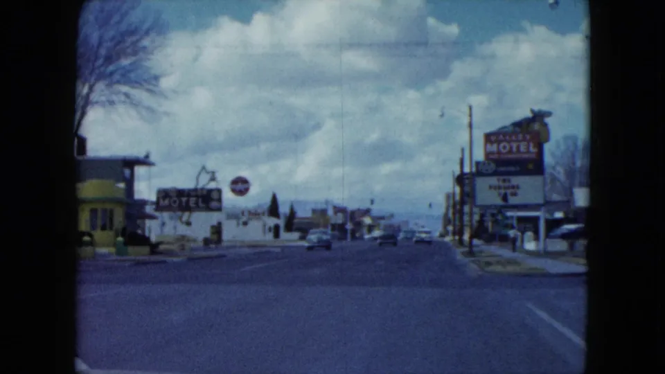 1959 Nevada home-movie view down a quiet motel-lined street from a moving car.