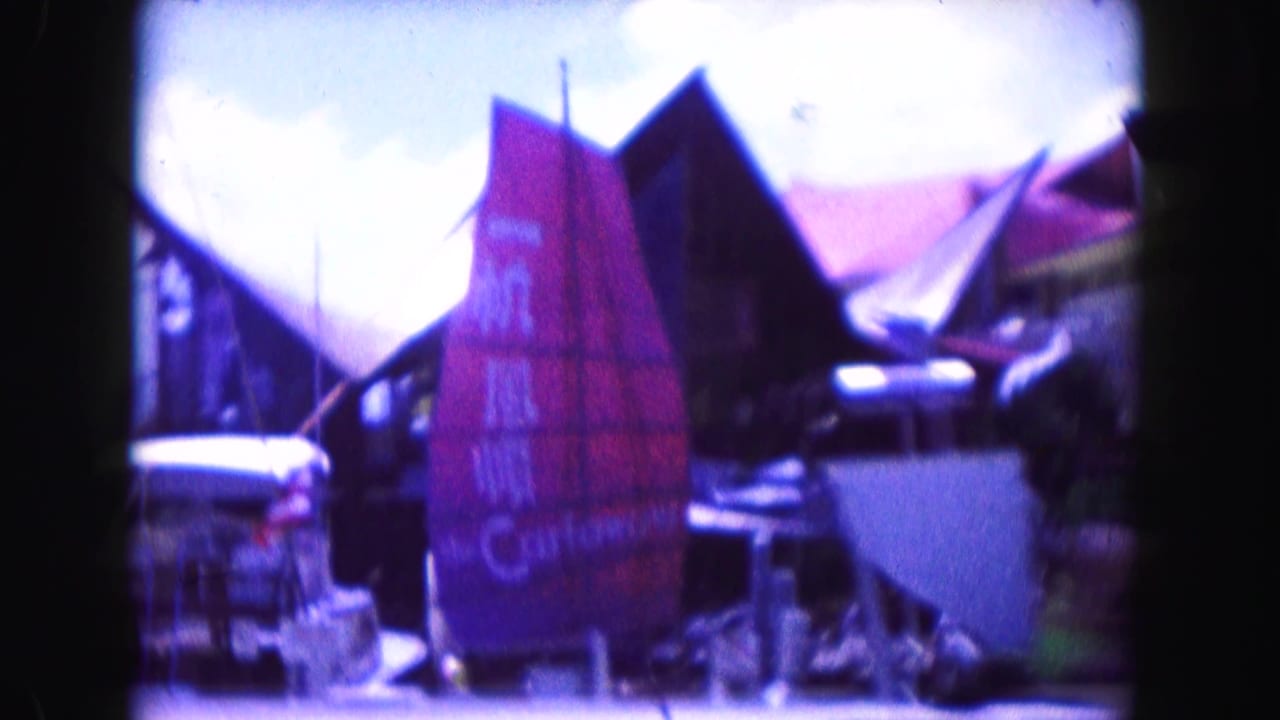 Themed restaurant exterior with steep rooflines, signs, awnings, and outdoor structures.