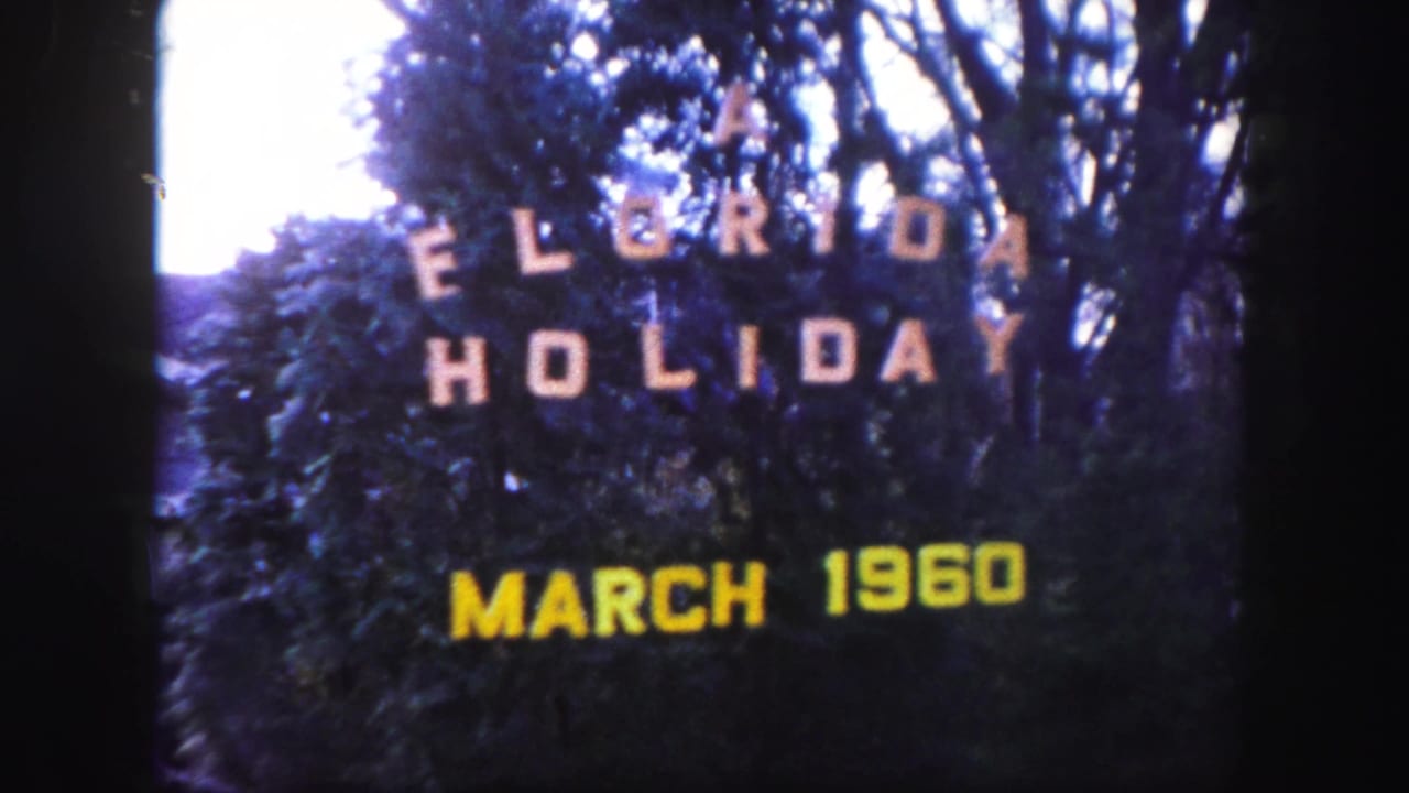 Title card reading "A Florida Holiday March 1960" in front of trees and bushes.