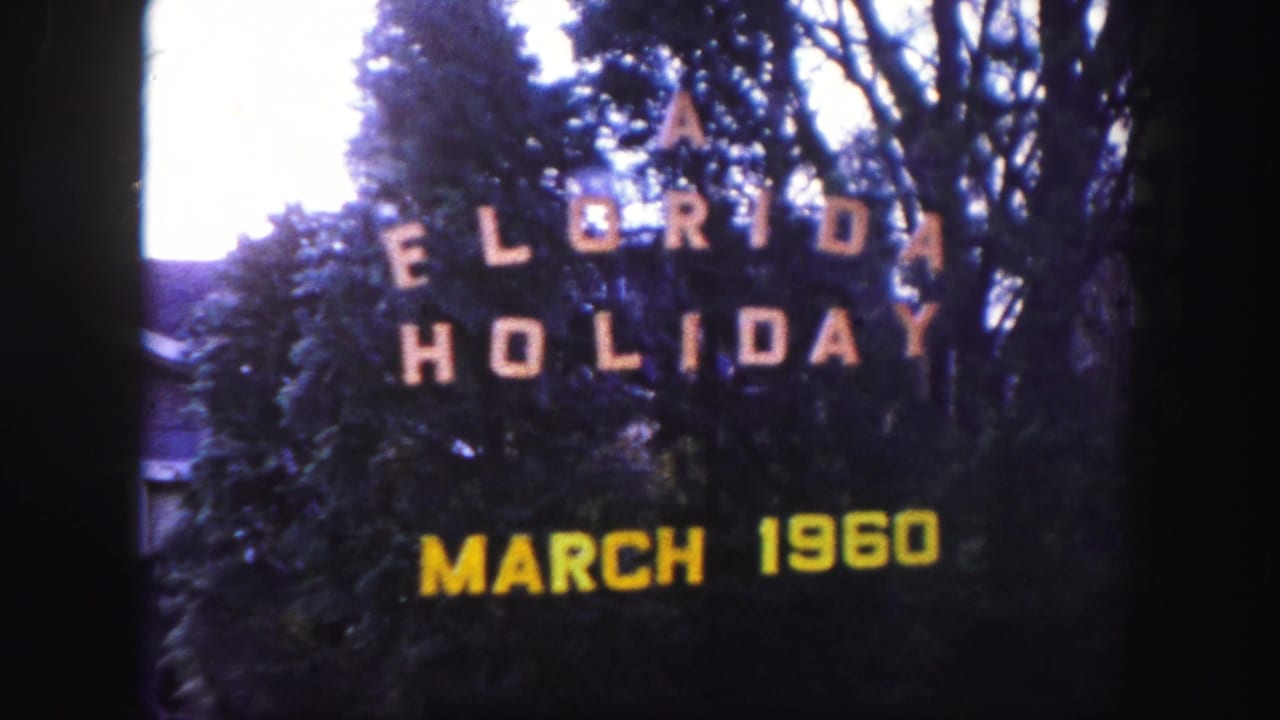 Second view of the "A Florida Holiday March 1960" title card among trees and bushes.