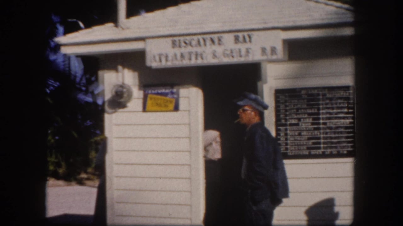 Uniformed station attendant at the Biscayne Bay Atlantic & Gulf RR booth, Tampa area Florida, circa 1960, 8mm color film.
