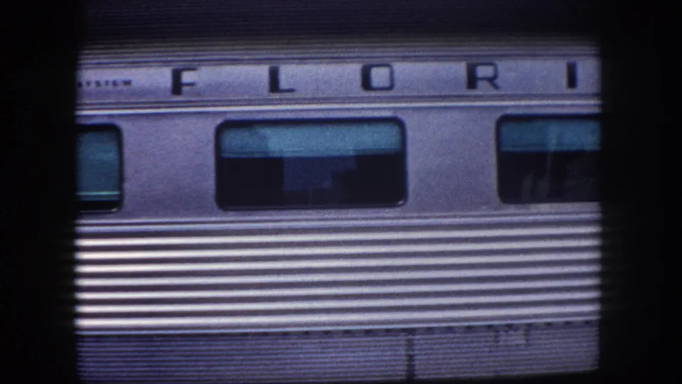 Flagler System 'FLORIDA' named train at Tampa station, c. 1960, showing tinted rectangular windows and fluted stainless steel body.