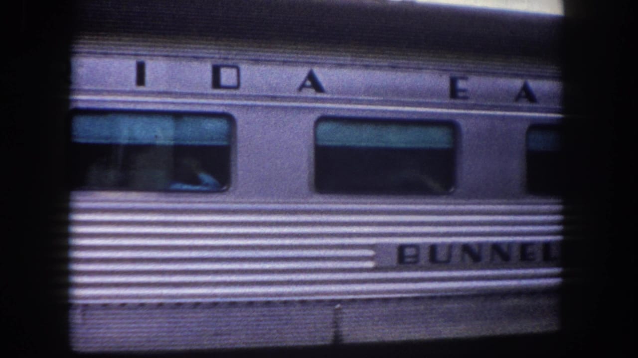 1960 Tampa area: stainless-steel railcar with 'BUNNELL' nameplate and partial lettering consistent with 'IDAHO' and 'EAST' above, captured in 8mm close-up.