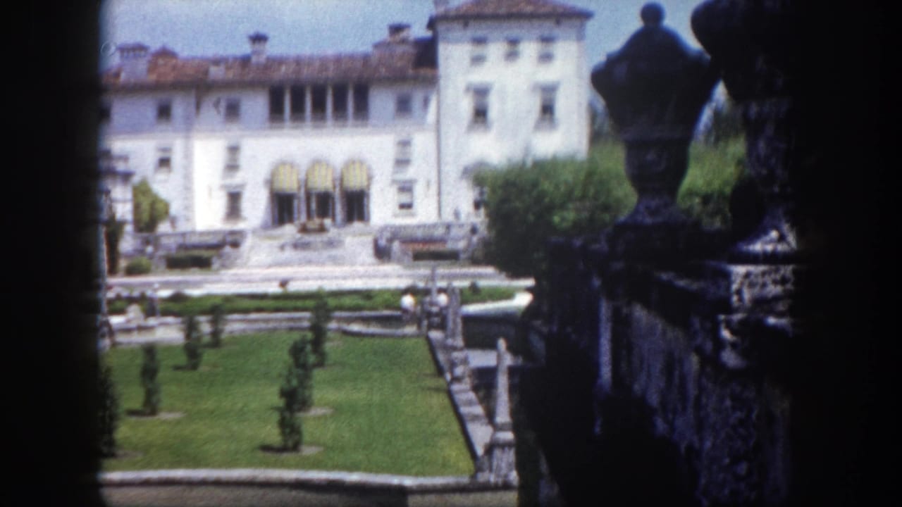 8mm home movie circa 1960 showing a white Mediterranean Revival-style estate and manicured formal garden in Tampa, Florida.