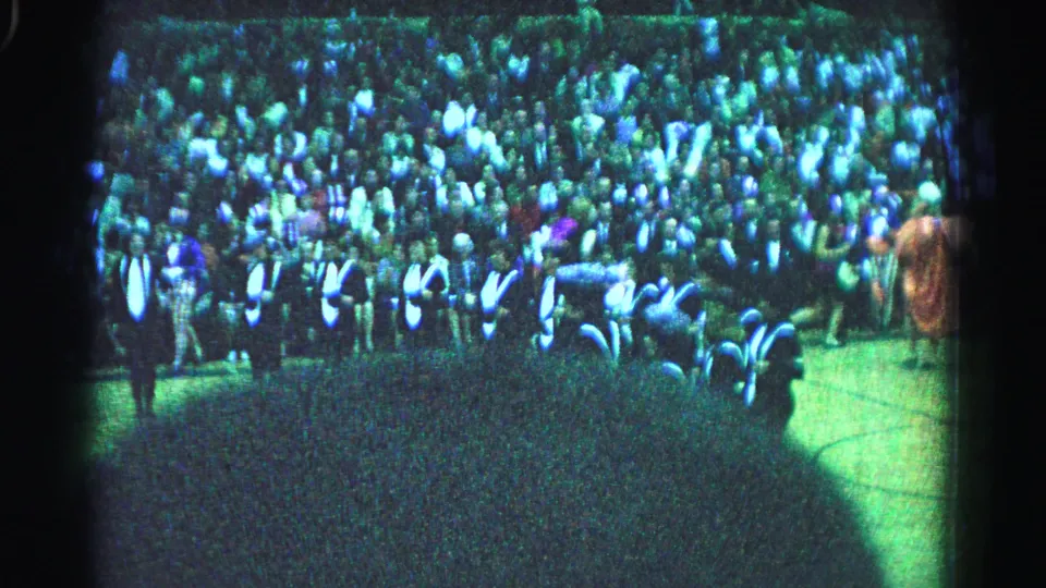 8mm footage of large outdoor crowd, Hagerstown Maryland 1963, from elevated position with green tint and visible film grain.
