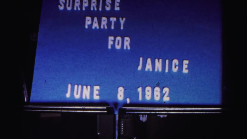 8mm frame of the blue title card reading surprise party for Janice, with the June 8, 1962 date visible near the bottom.