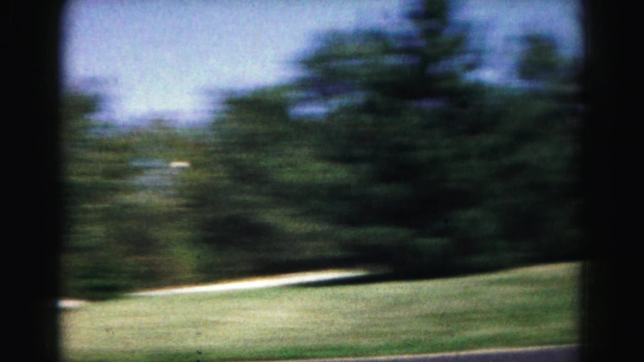 The camera pans across a Hagerstown lawn and trees during the backyard tennis practice, with the player largely out of view.