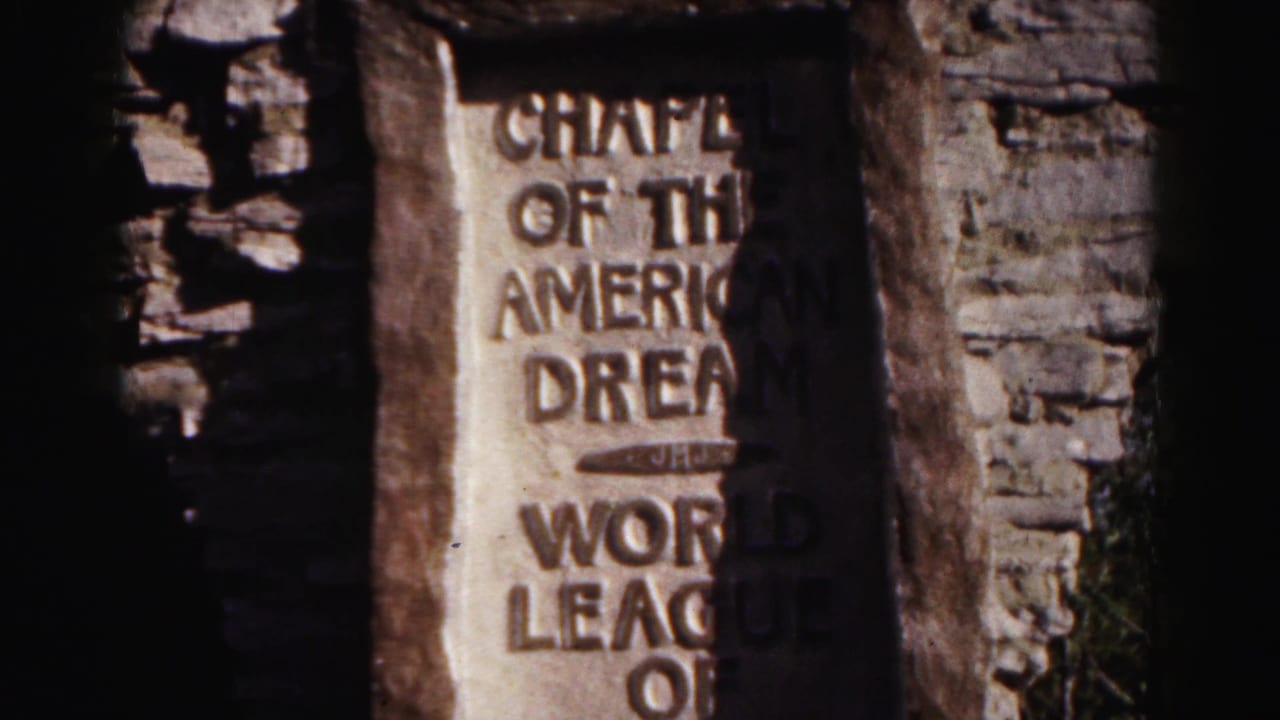 The plaque is framed more centrally, showing Chapel of the American Dream and World League of Cities lettering in a rustic stone setting.