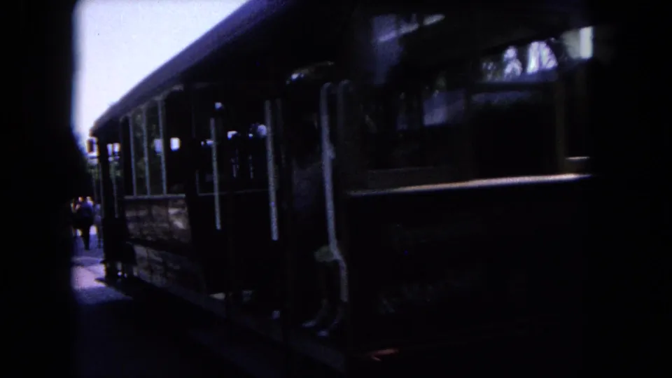 A trolley or rail car appears at the end of the 1962 Tijuana home-movie clip, with people visible near the side.