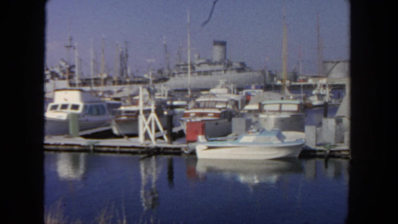 San Diego harbor footage from 1962 showing pleasure boats at the docks and a large liner behind the marina.