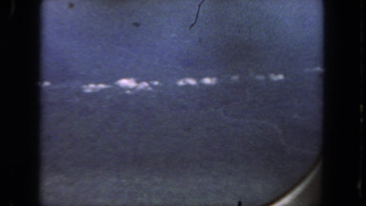 Blue-gray blurred view with dark 8mm borders and a line of small white highlights.