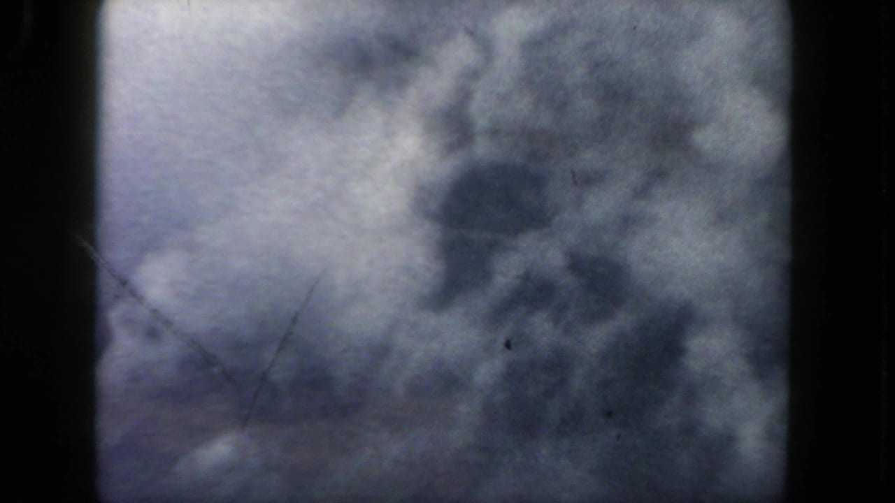 Bright cloud mass seen from above with dark 8mm frame edges.