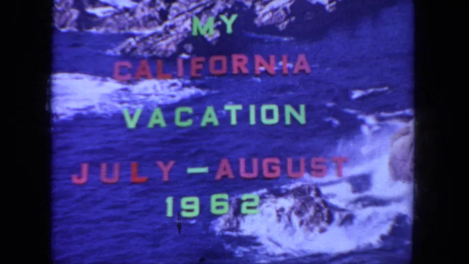 A closer 8mm frame shows the 1962 California vacation title over white surf, dark blue water, and shoreline rocks.