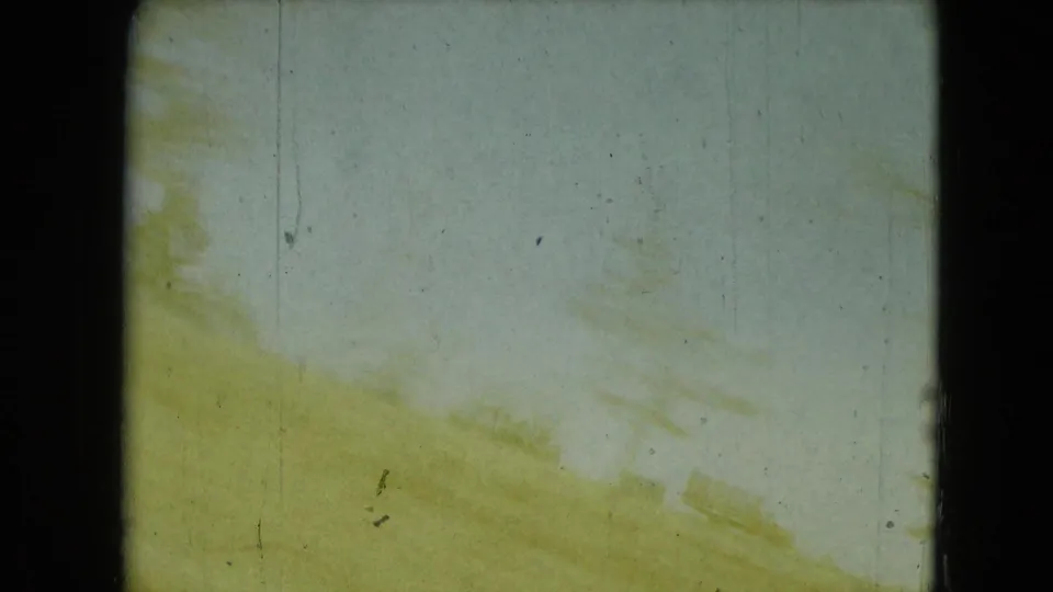 1962 Mexico City-area 8mm frame showing a washed yellow-green roadside view with faint tree shapes, scratches, and strong exposure shift.