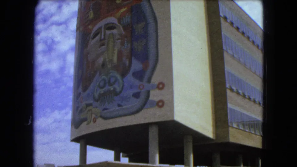 1962 Mexico City close view of a colorful abstract mural mounted on the corner of a modernist building.