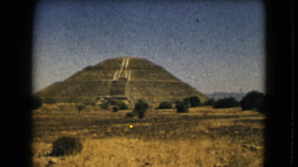 The 1962 8mm footage holds on the stepped pyramid and central stairway near Mexico City.