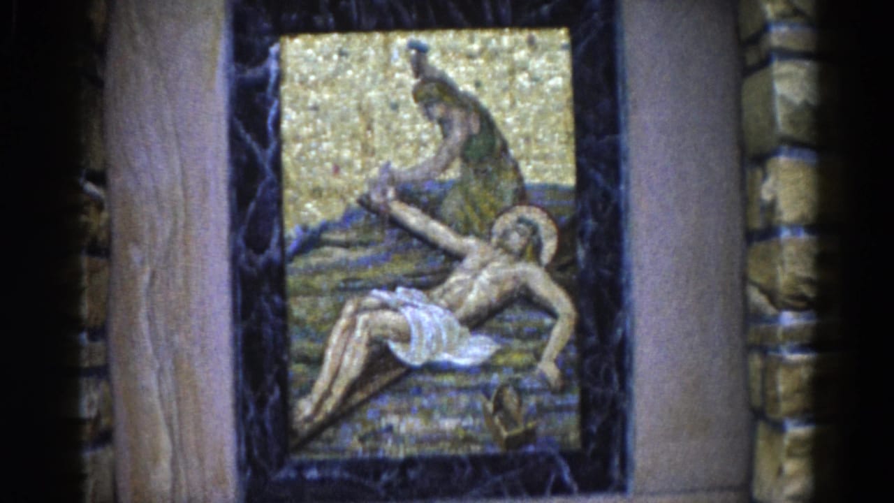 Same Lamentation of Christ mosaic between wooden pilasters, slightly reframed to show more of the dark surround.