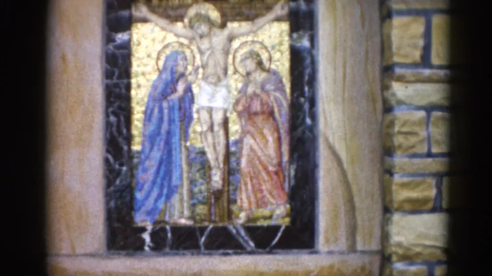Crucifixion mosaic with Mary in blue and John in red flanking the cross, set in a stone niche in an Illinois church, ca. 1962.