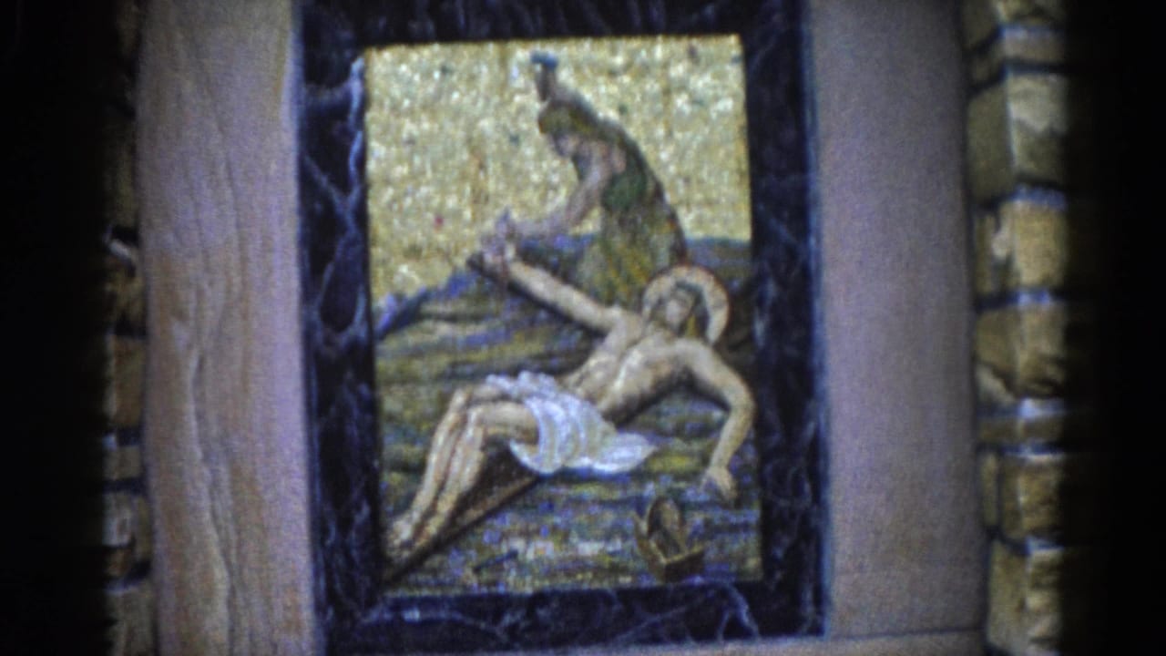 Close-up of a devotional mosaic depicting a mourning figure over a reclining haloed figure, gold tesserae background, dark marble border, Illinois c.1962.