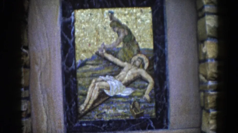 Close-up of a devotional mosaic depicting a mourning figure over a reclining haloed figure, gold tesserae background, dark marble border, Illinois c.1962.