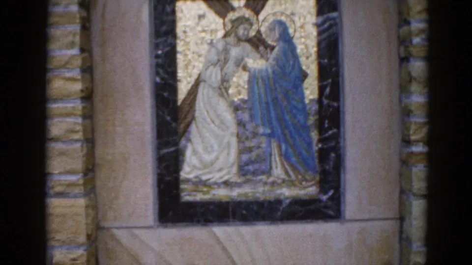 Detail of church mosaic panel, Illinois, c.1962; two haloed figures, one in white and one in blue robes, set against gold tesserae in a dark marble frame.