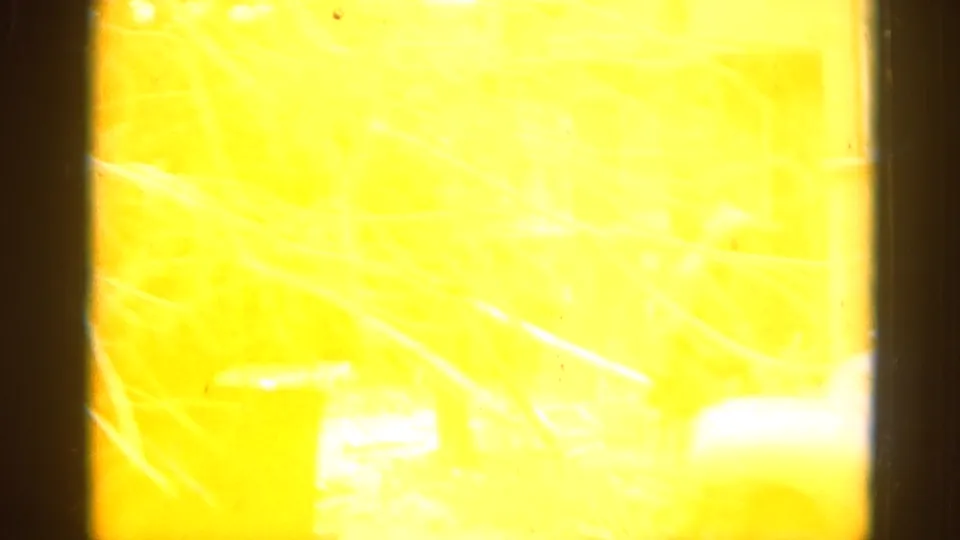 End-of-clip color shift to intense yellow in a 1962 Illinois 8mm home movie, characteristic of dye-layer degradation in aged film stock.