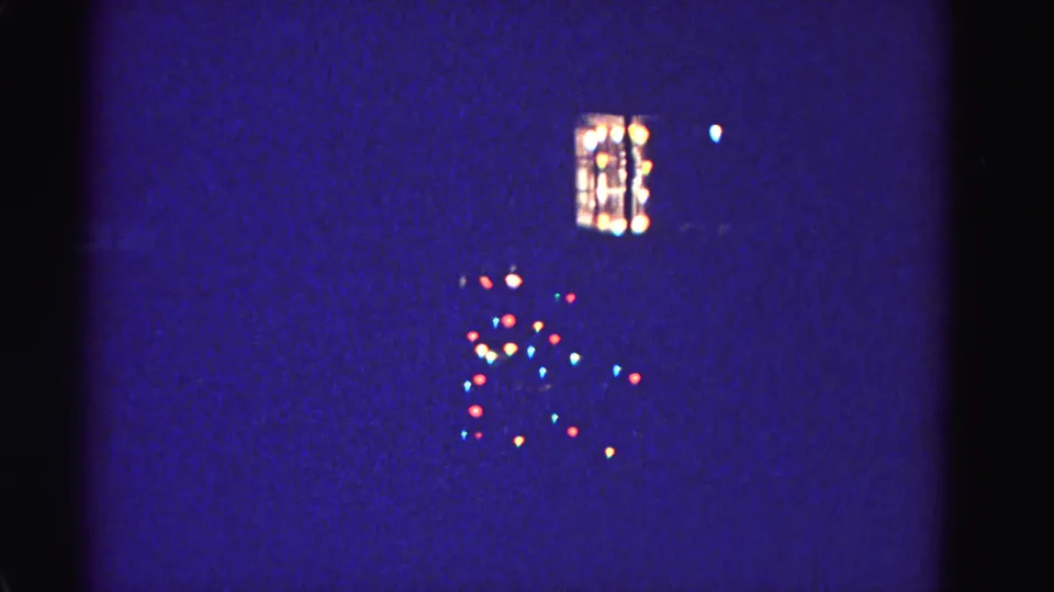 1962 home movie, yard Christmas light arrangement and lit window at night, Hagerstown, Maryland; 8mm night exposure with blue color cast.