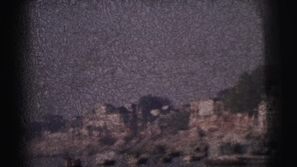 8mm home-movie frame circa 1962 showing a wide Calcutta river expanse with the built-up bank visible at the lower edge, likely captured during a camera pan or tilt.