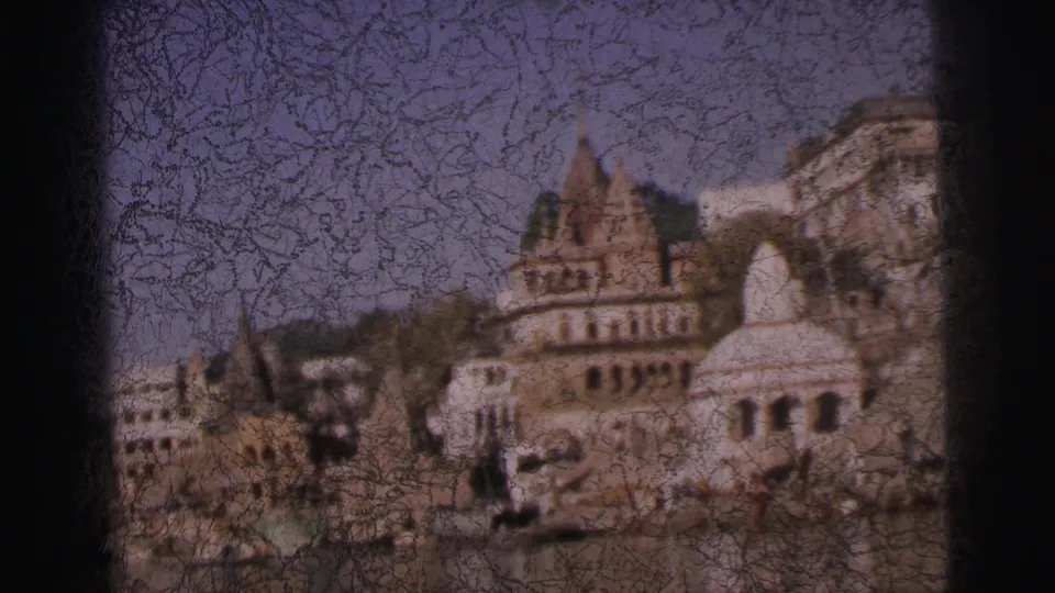 Hindu temple complex and dome above ghat steps, Calcutta, India, c.1962; significant emulsion cracking across the 8mm frame.