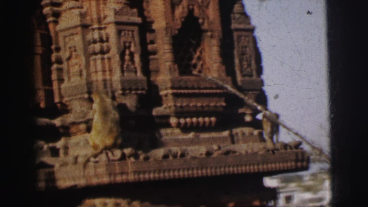 Primates on the carved stone cornice of an ornate Indian temple with tiered tower, attributed to Calcutta, India, circa 1962, 8mm film.