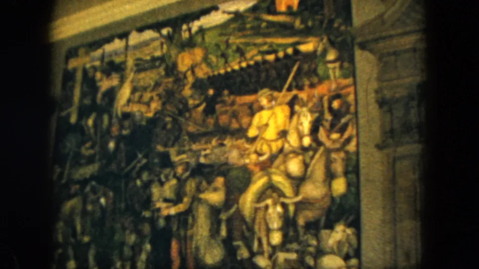 1962 Acapulco home-movie frame showing a closer view of the mural's riders, horses, figures, and architectural border.