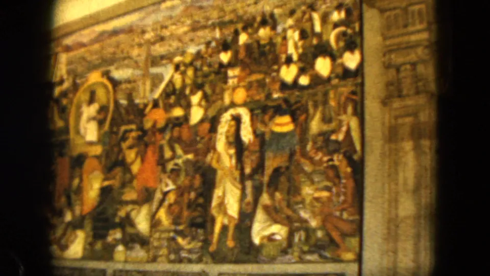 1962 Acapulco frame showing another mural section with grouped figures, a central light-clothed figure, and religious or historical imagery.
