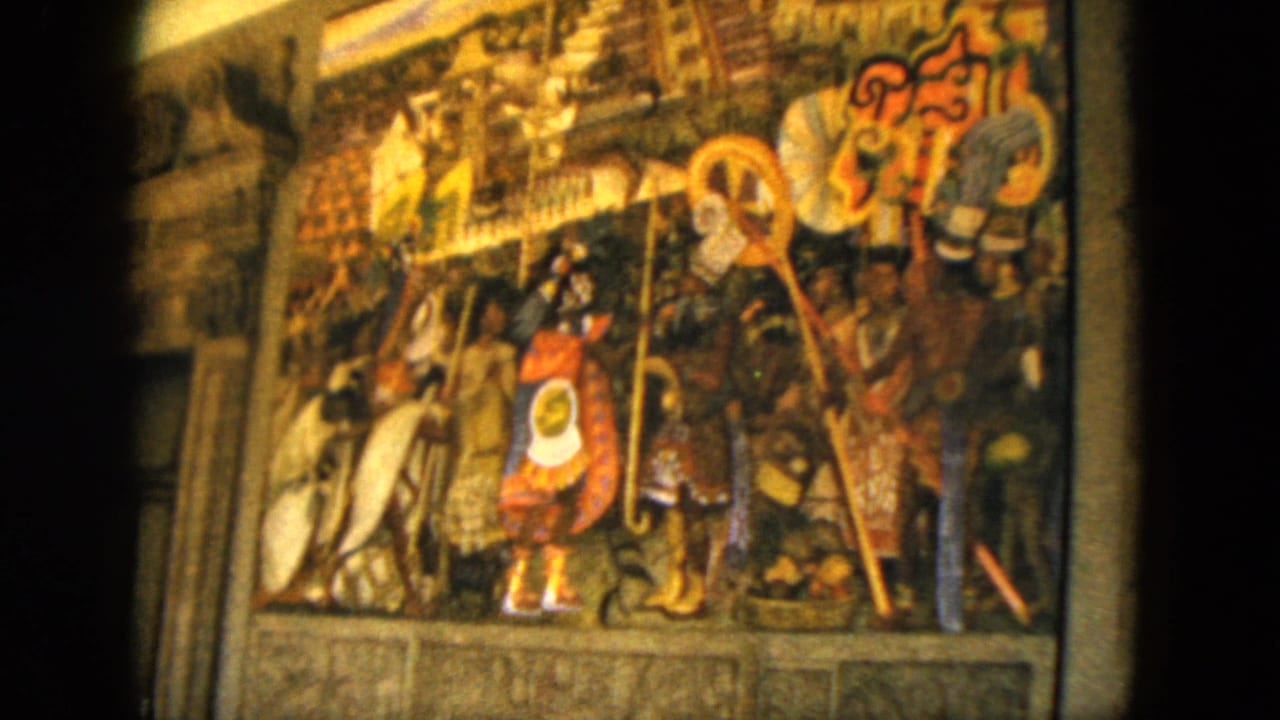 Large colorful mural with historical or cultural figures inside a dim interior.