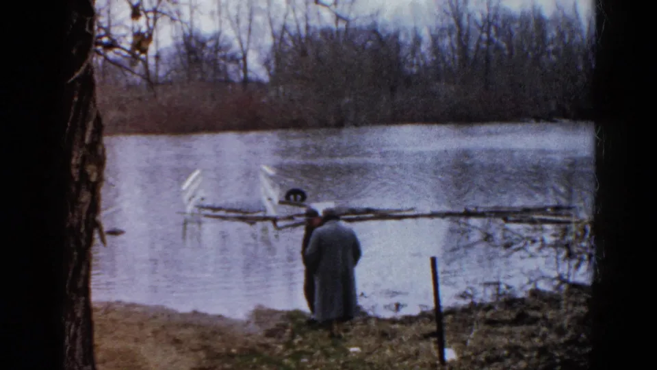 The final 1961 Wauconda frame shows two adult men at the water's edge, partly framed by dark trees.