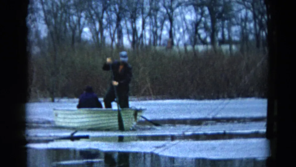 The final frame shows the 1961 Wauconda rowboat with a standing man, seated passenger, oar, icy pond surface, and winter shoreline.