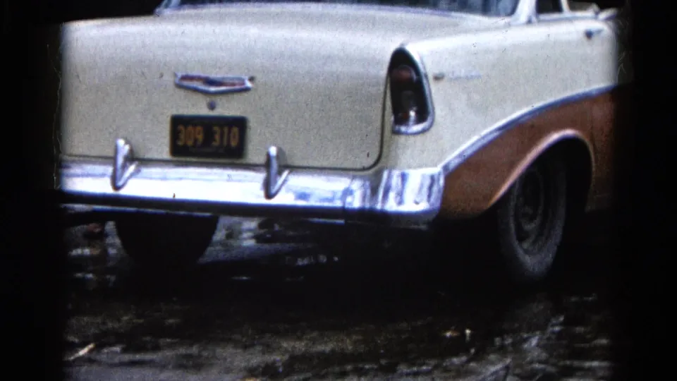 Rear view of a two-tone Chevrolet Bel Air parked near flooded ground in Wauconda, Illinois, in 1961.
