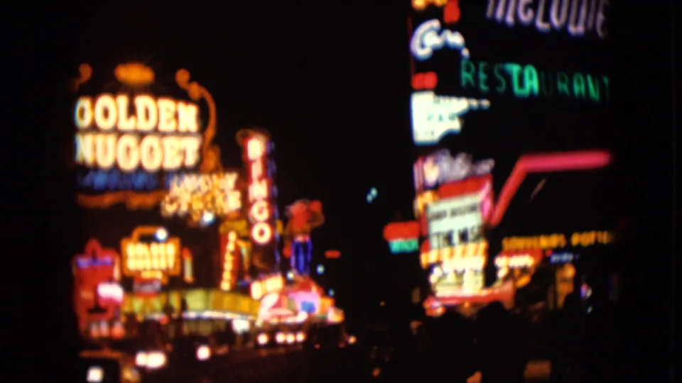 1961 Nevada street view with the Golden Nugget sign, bingo lettering, and multiple neon storefront lights.