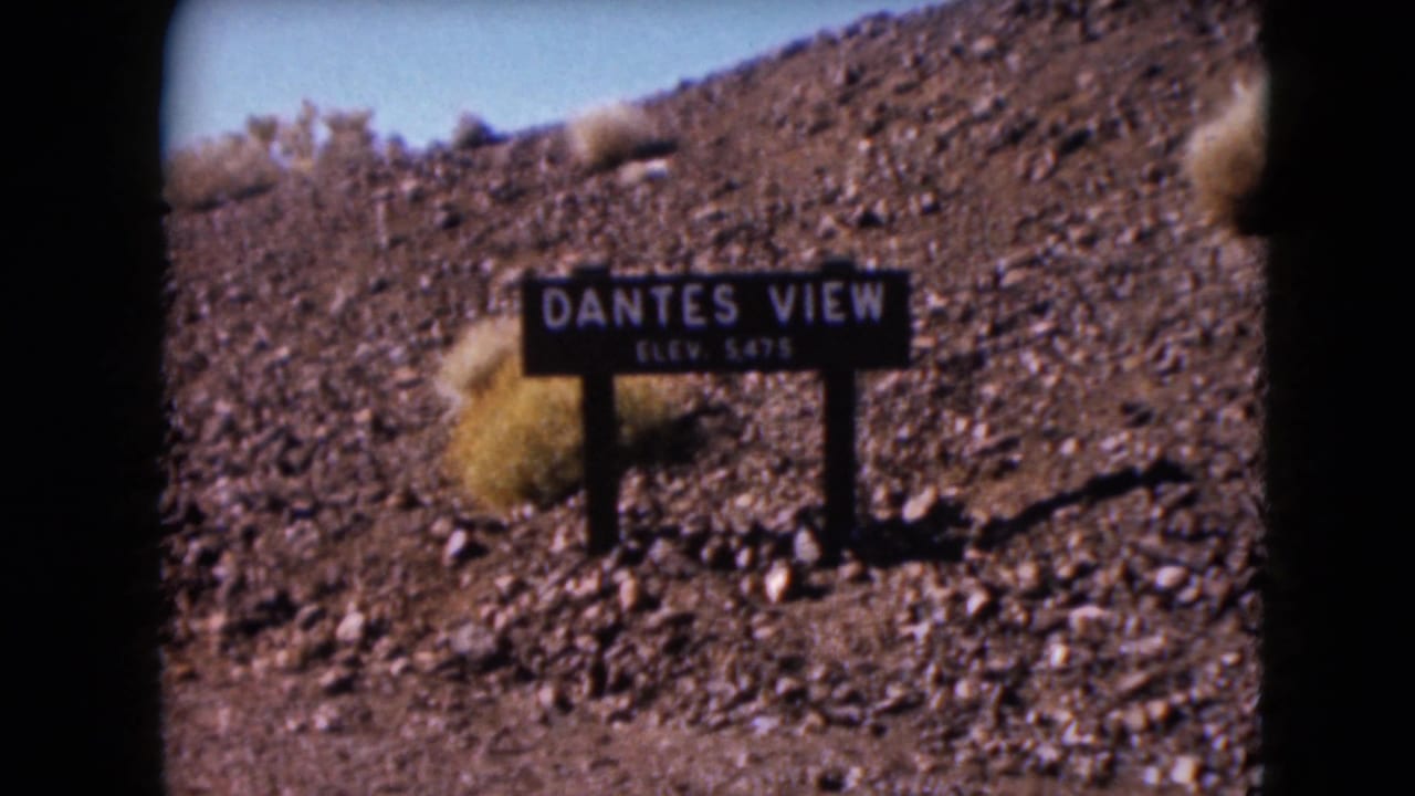 Dante's View elevation sign on a rocky desert hillside.
