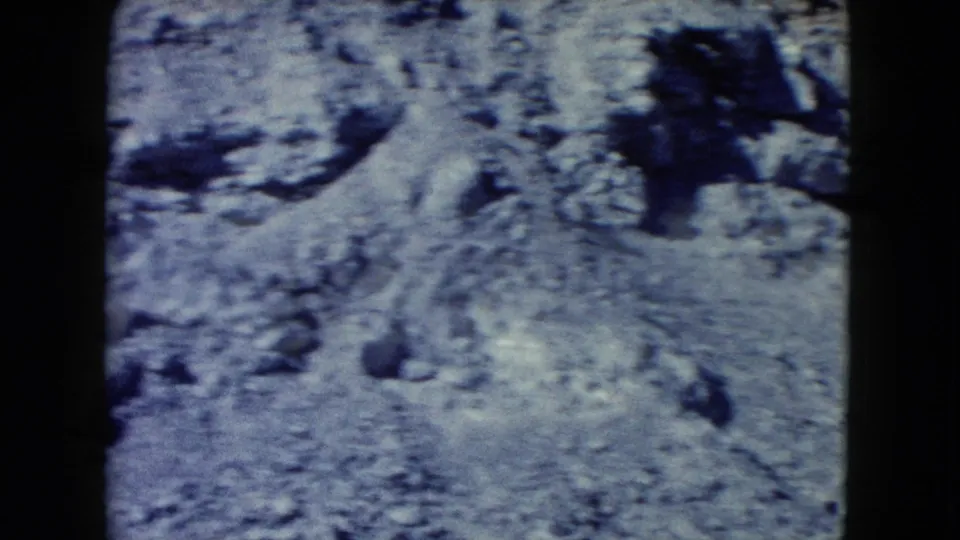 Handheld 8mm view of rocky Nevada desert terrain, with no people or landmarks visible in this frame.