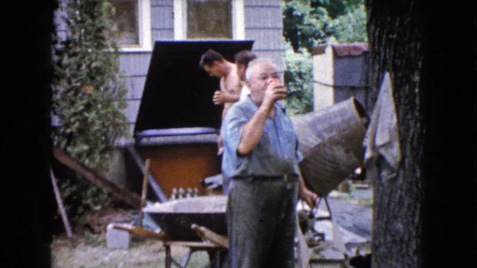 The final frame shows the older man drinking from a red cup in the Wauconda yard as two younger men shift position near a cement mixer.