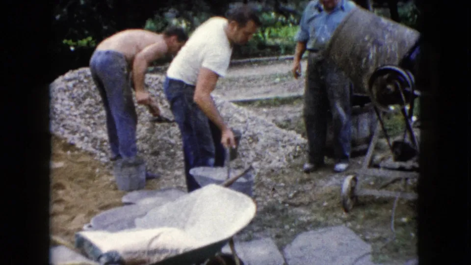 The final frame shows the Wauconda outdoor work scene continuing with shoveling, buckets, gravel, and the mixer visible.