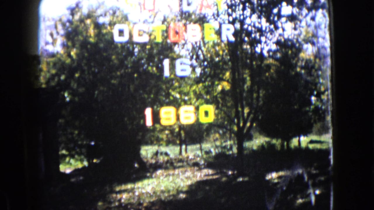 8mm home-movie frame from Wauconda, Illinois, with a colorful October 16 1960 date title over trees and lawn.