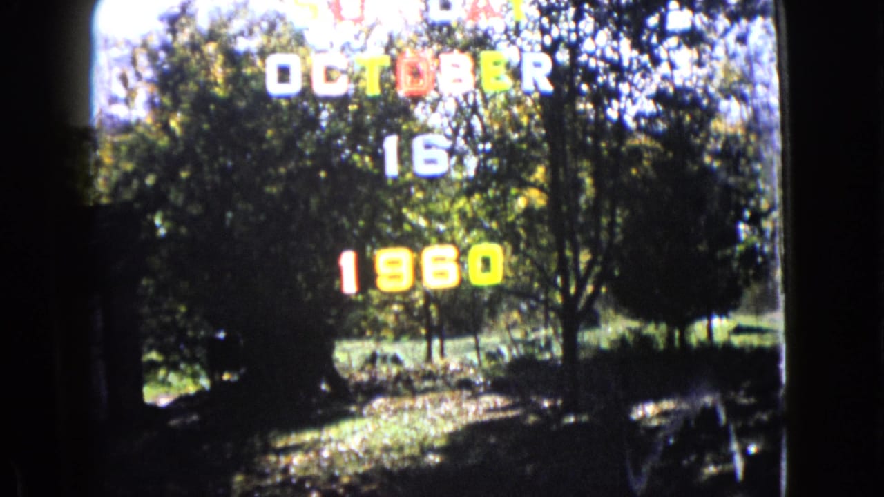 Color 8mm frame with an October 16 1960 title over trees and lawn, used as the clip's dated opening.
