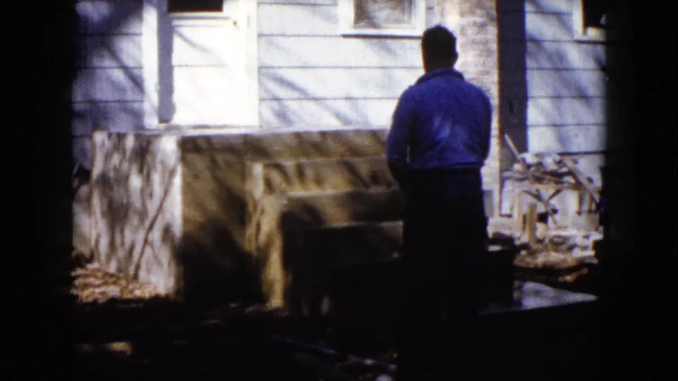 At the end of the short 1960 Wauconda clip, the man stands with his back to camera as water hits the new concrete porch steps.