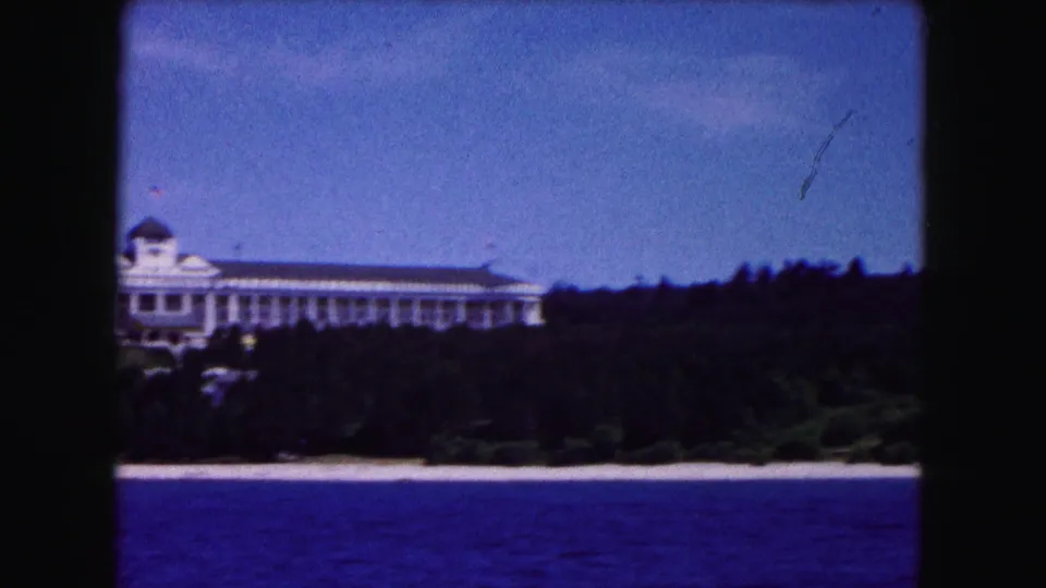 A closer 8mm glimpse shows part of the Buffalo-area lakeside hotel, partly cropped by the home-movie framing.