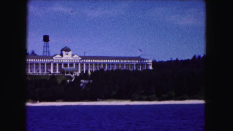 1961 8mm frame of the lakeside hotel near Buffalo, showing its central dome, long facade, and water tower.